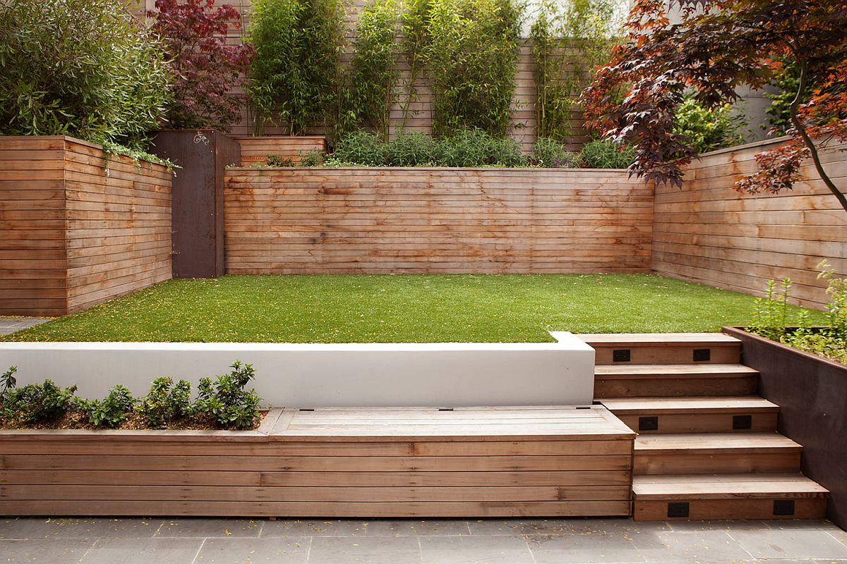 Custom wooden bench in the backyard aso serves as a storage option