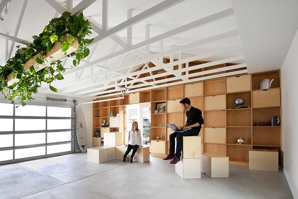 Custom wooden units and shelves transform the interior of this garage
