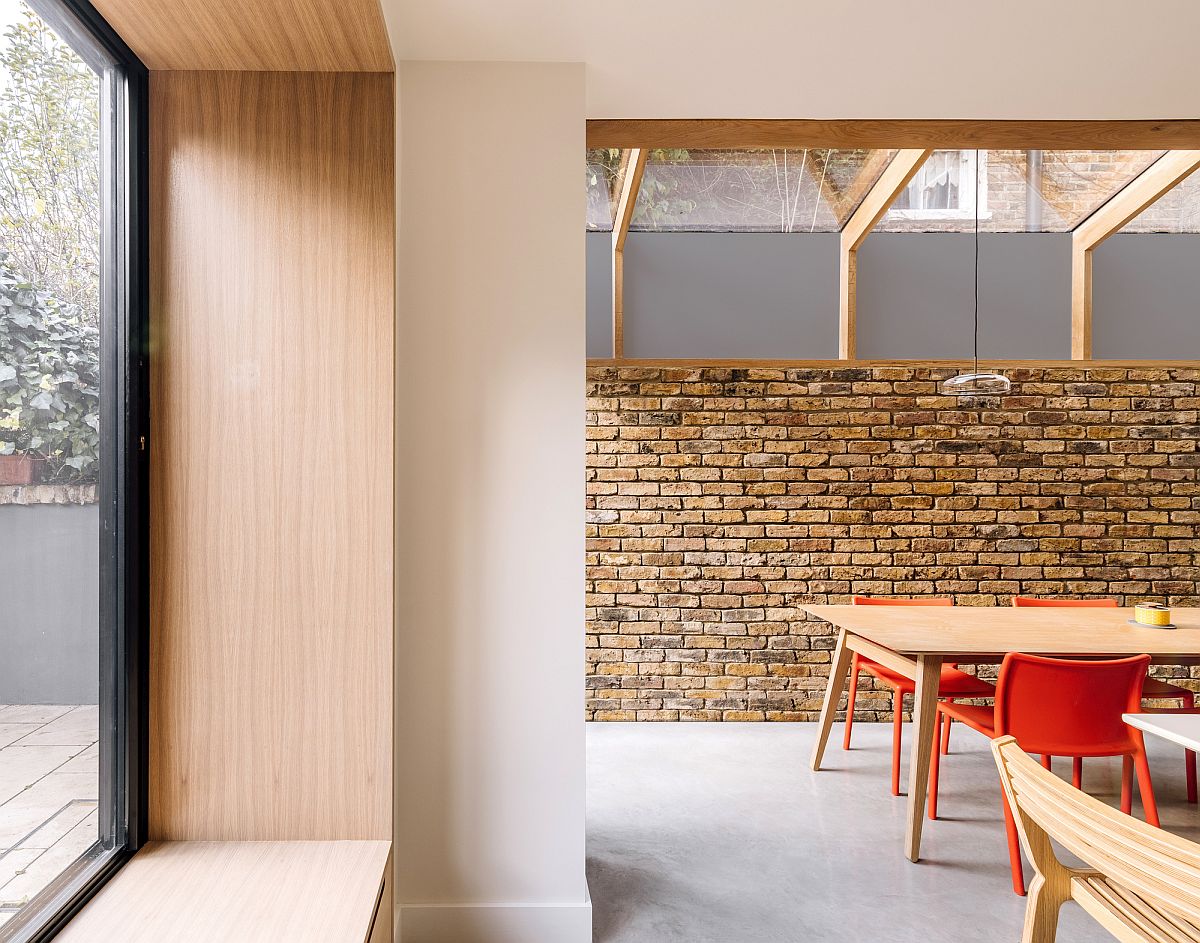 Exposed brick walls, polished concrete floor and oak finishes find space next to one another inside this London home