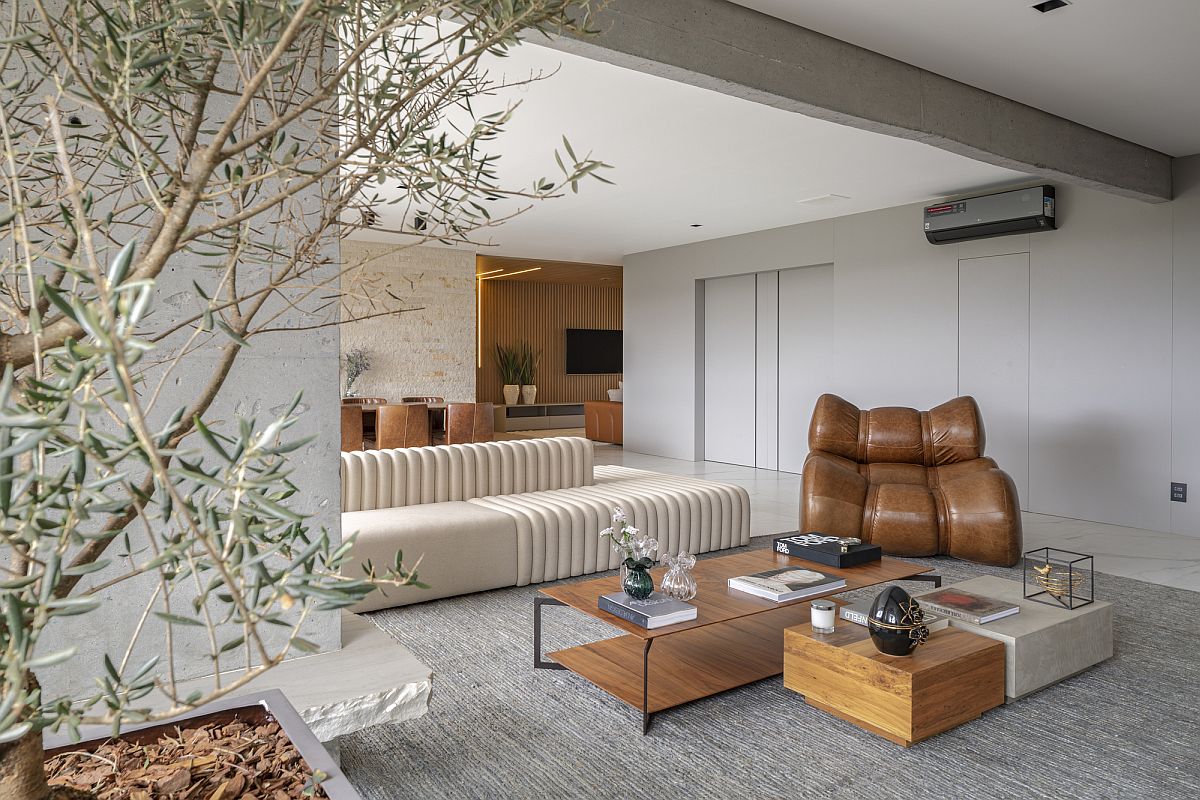 Exposed concrete beams and pillars bring a different textural element to the contemporary interior