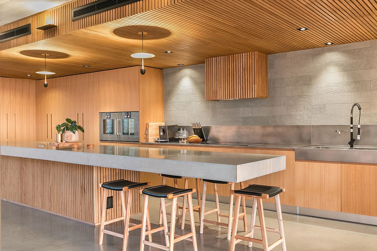 Extend the kitchen island to create a space-savvy eat-in kitchen that is the perfect social zone