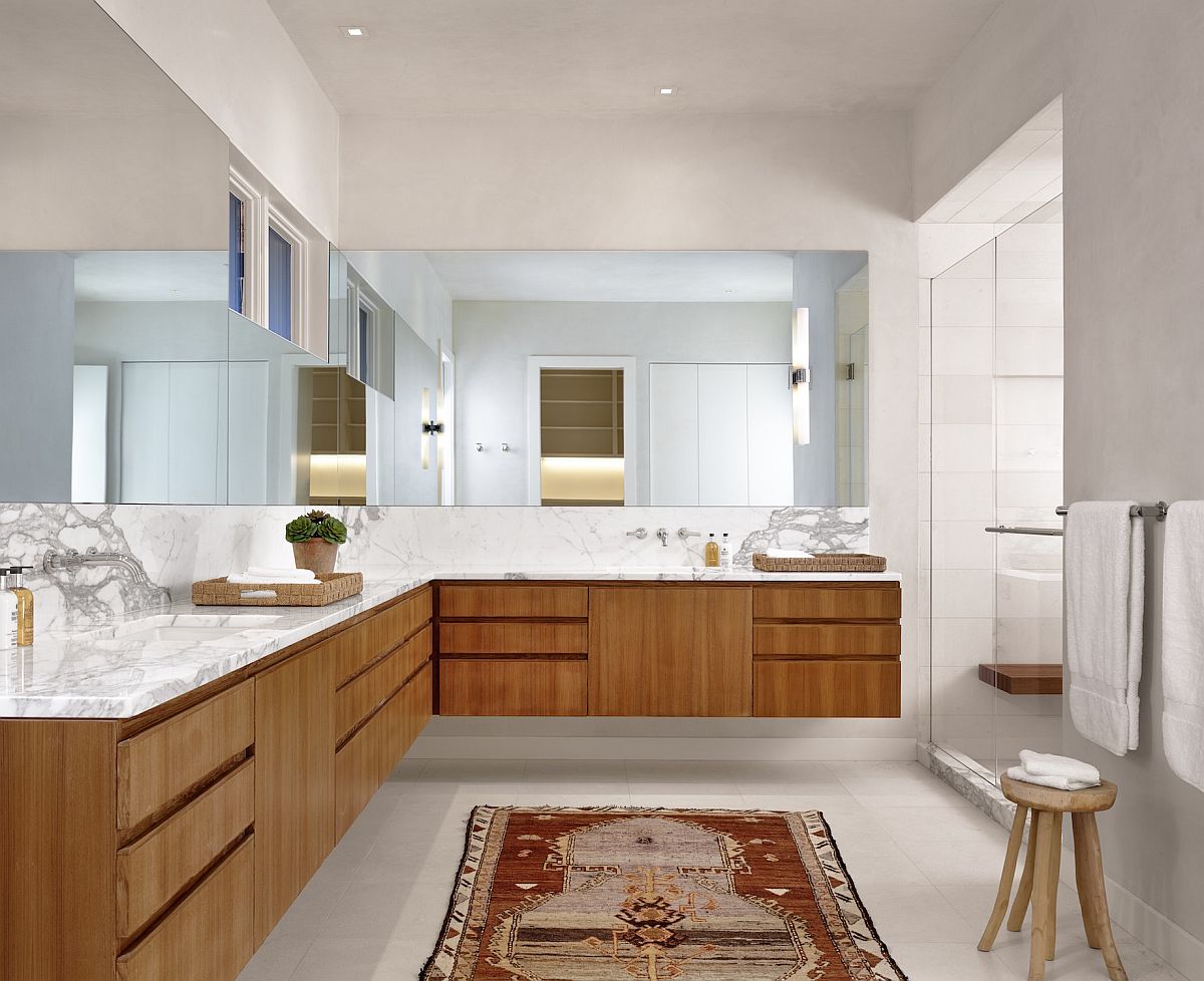 Extensive design of the custom vanity makes the biggest impression in this large, modern minimal bathroom