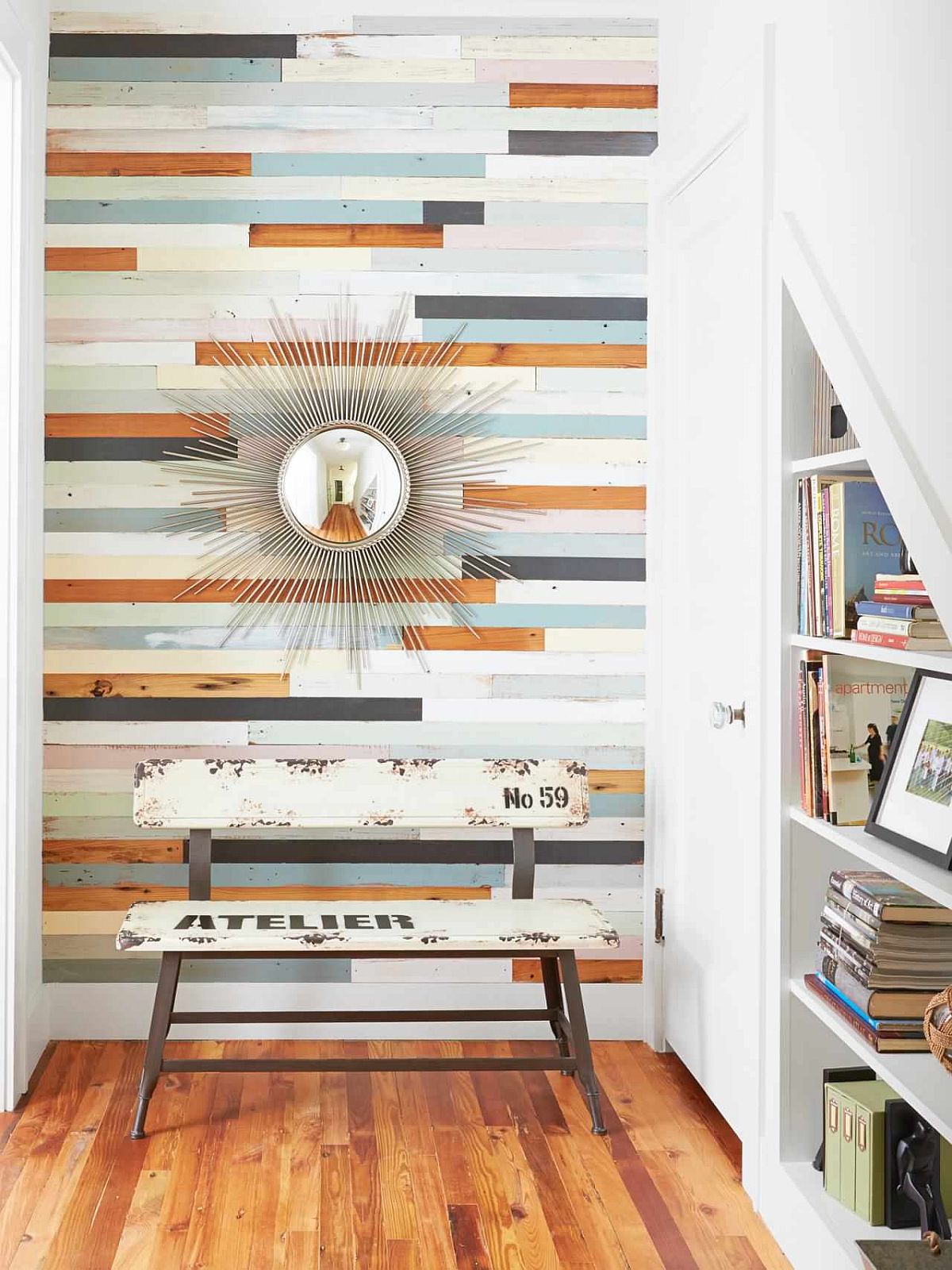 Eye-catching accent wall for the entry was designed using reclaimed floor wood