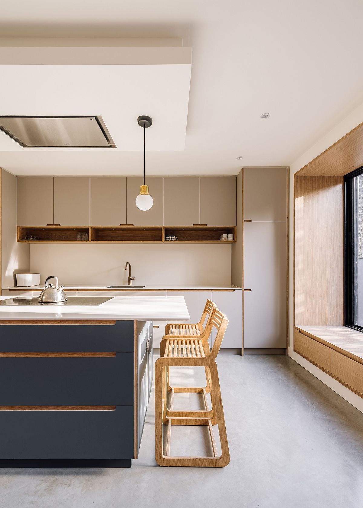 Fabulous-bluish-gray-central-island-of-the-spacious-new-kitchen-with-roof-light-79663