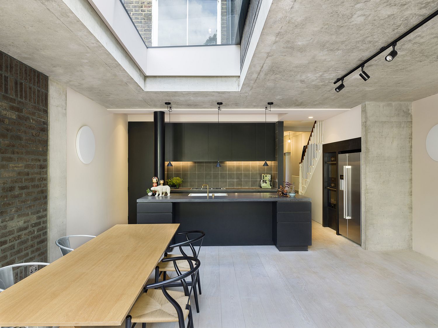 Fabulous-new-social-kitchen-and-dining-area-inside-concrete-and-brick-rear-extension-of-Victorian-terraced-house-in-London-by-Gundry-Ducker-19366