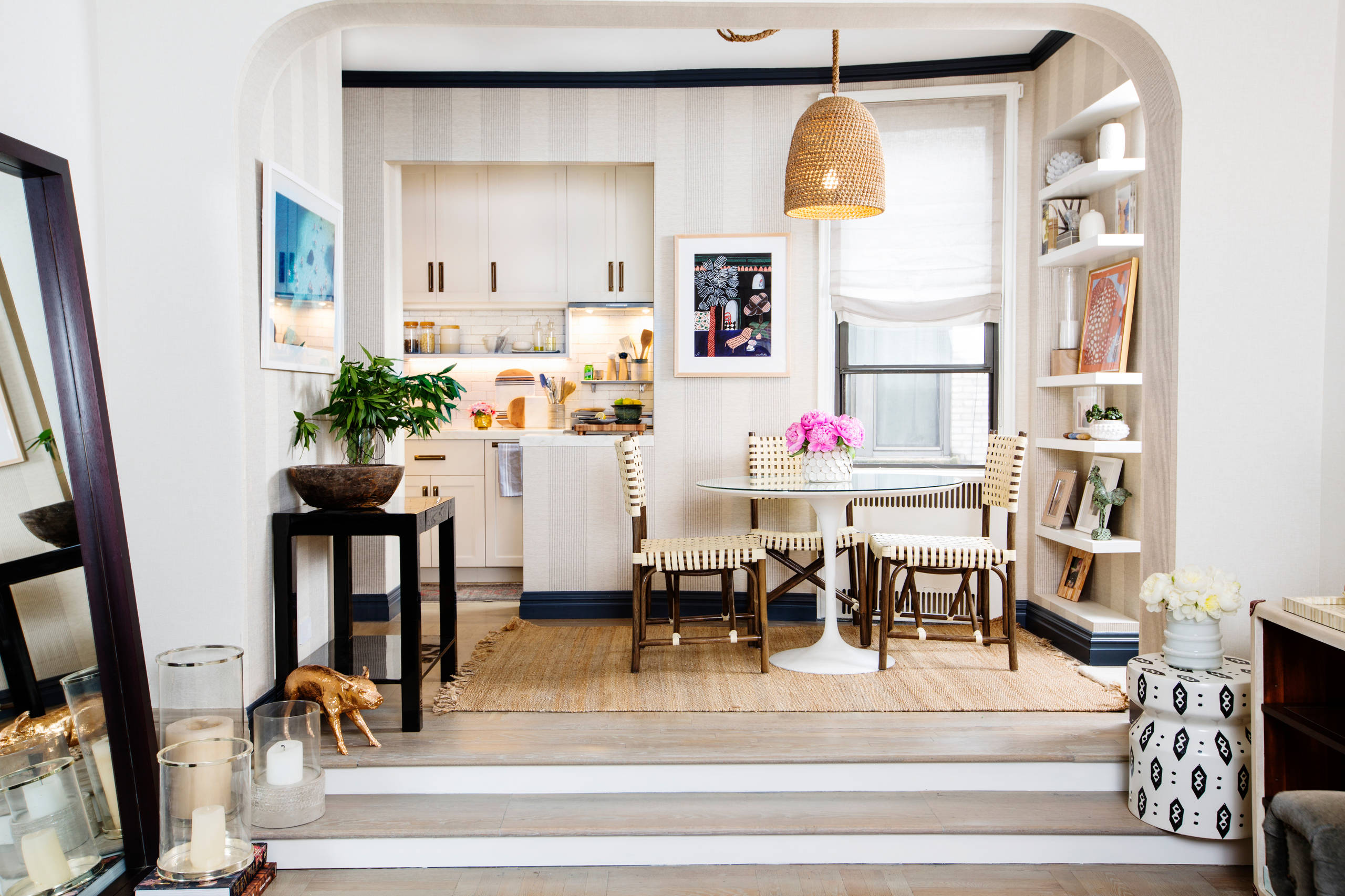 Fabulous small kitchen and dining room of apartment in Chelsea with white holding fort!