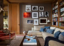 Family-room-with-gallery-wall-on-one-side-and-bookshelves-on-the-other-12628-217x155