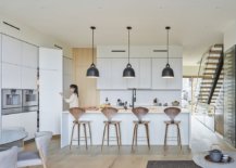 Functional-modern-kitchen-in-white-and-wood-with-dark-pendant-lights-63041-217x155