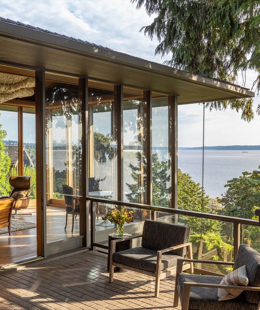 Glass walls on the upper level completely open up the interior to the scenic landscape outside