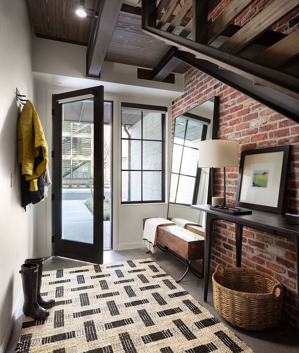 Gorgeous-industrial-style-entryway-of-stylish-Seattle-home-with-an-exposed-brick-wall-76828