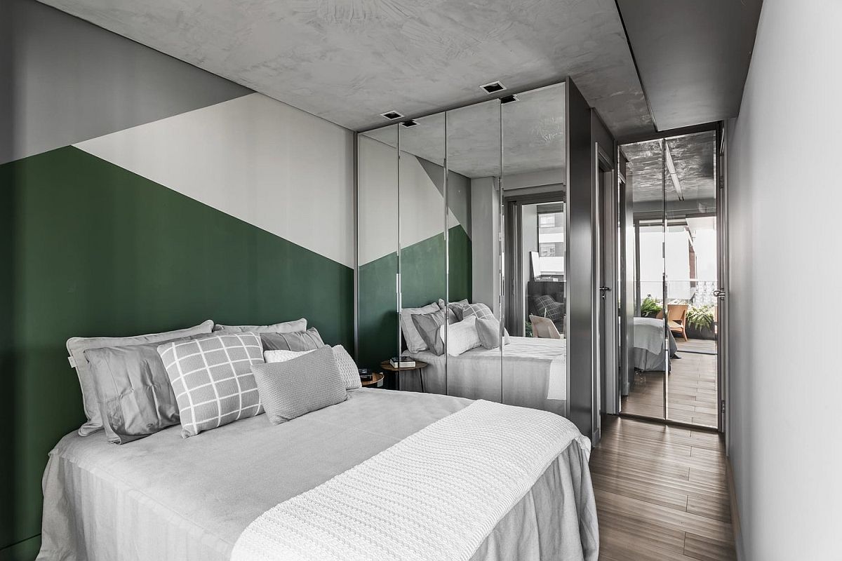 Gray, white and dark green blocks bring colorful geo style to the small bedroom