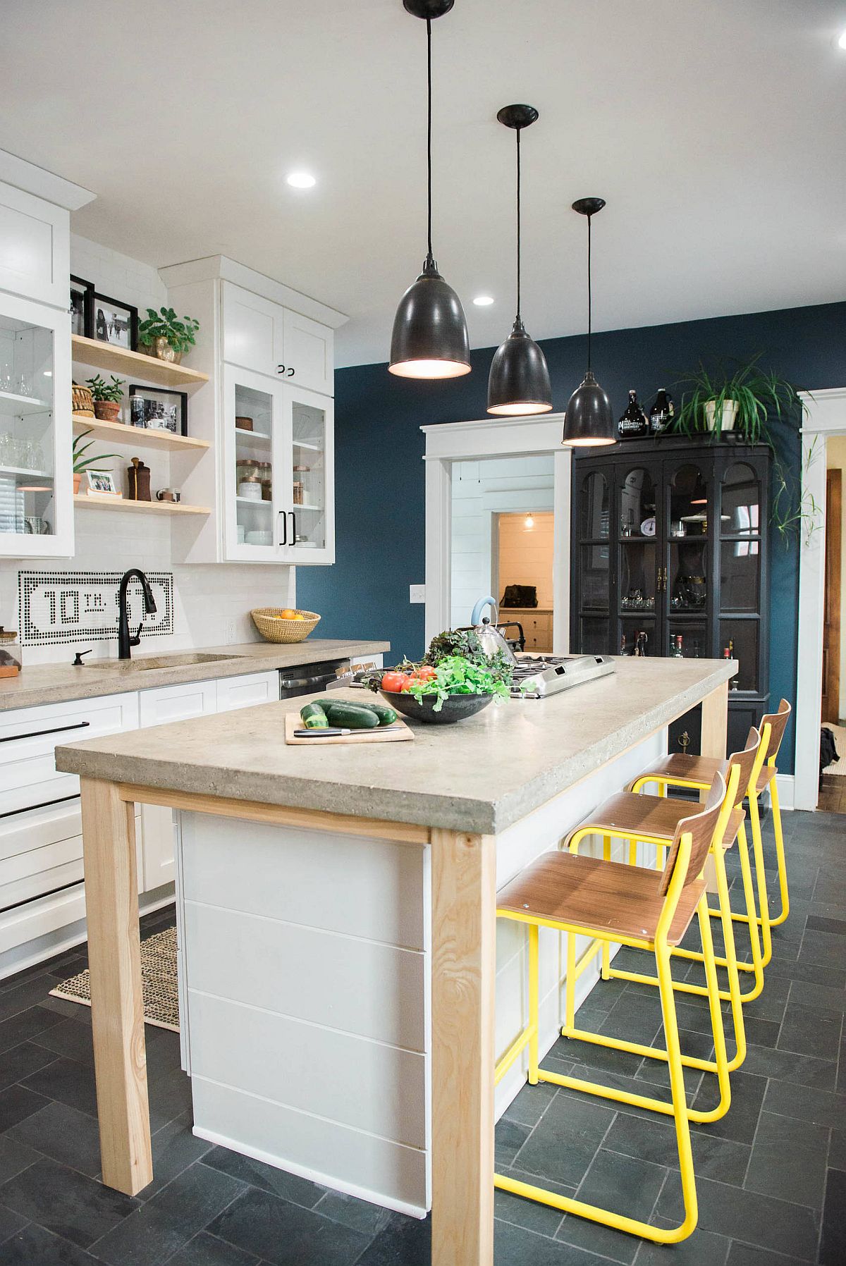 Ingenious small kitchen of New York home with lovely concrete countertops