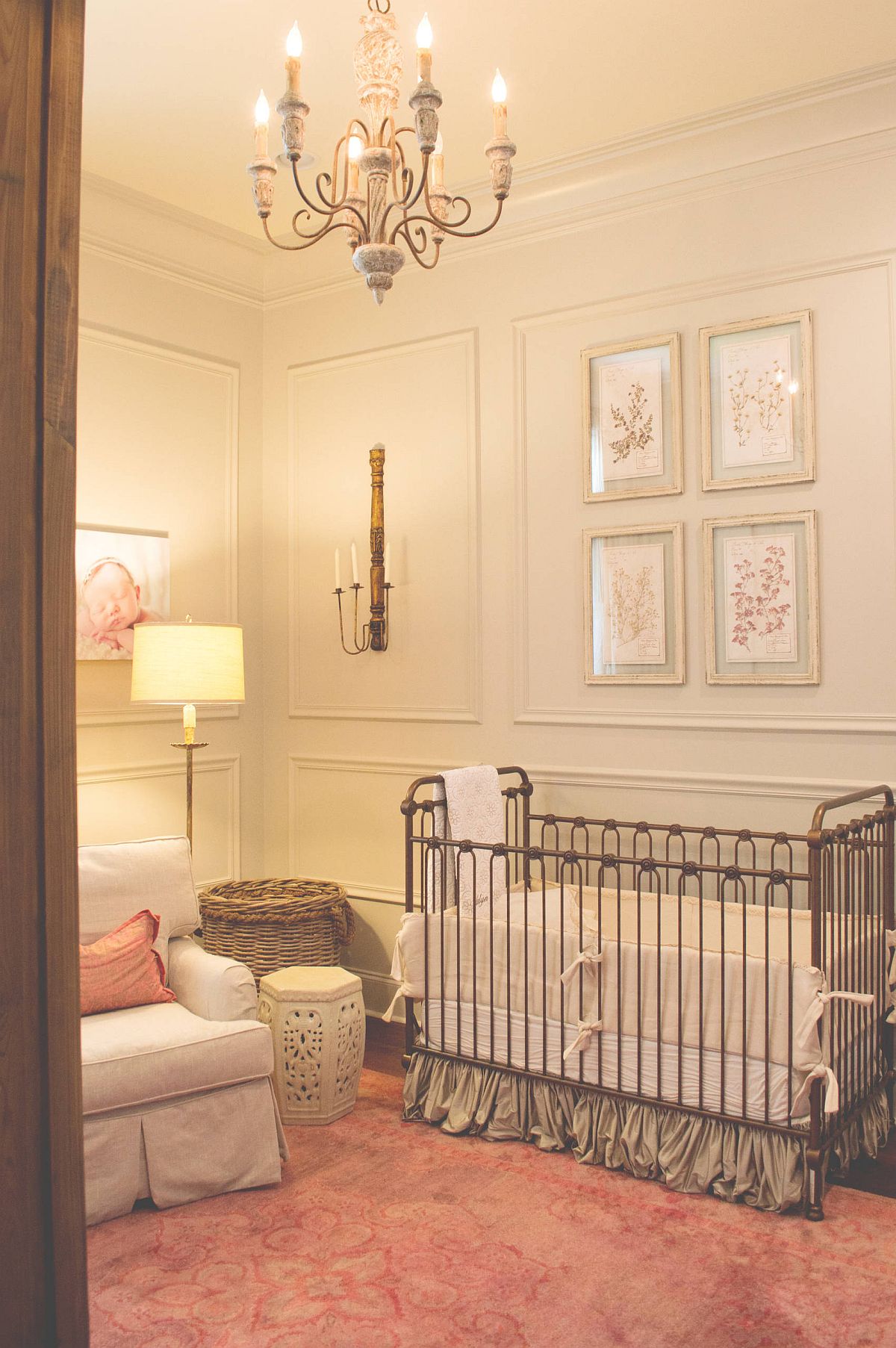 Light pinkish-orange accents and rug add an understated colorful charm to this traditional nursery