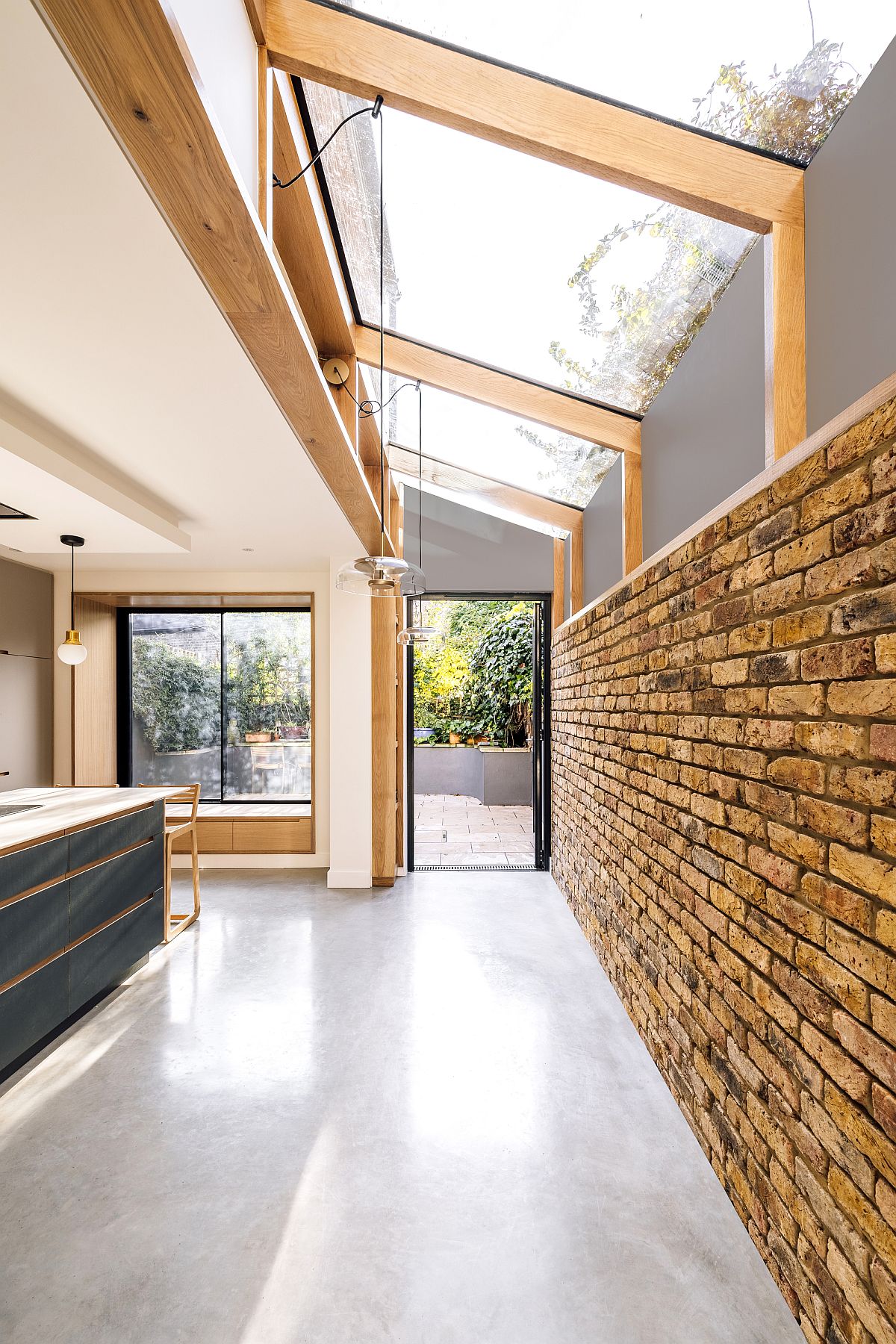 Lovely extensive roof light of the kitchen brings natural light into an aging Victorian home