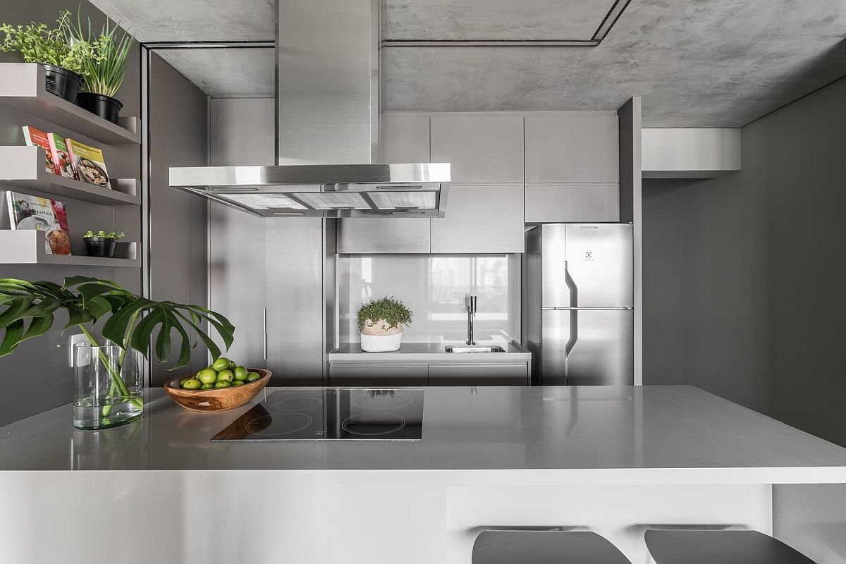 Metal and polished gray surfaces shape this gorgeous modern kitchen