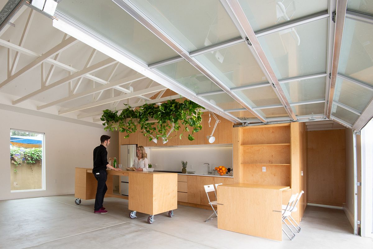 Mobile island brings modular comfort and ease to this fabulous garage interior