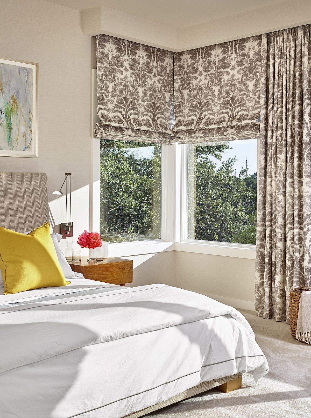 Modern bedroom in white with ample natural light and lovely views