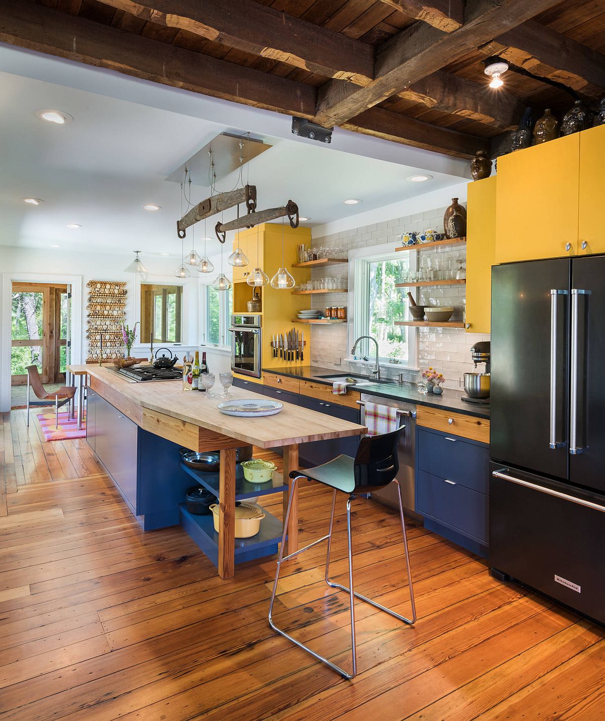 Modern farmhouse kitchen with brilliant splashes of yellow and blue thrown into the mix