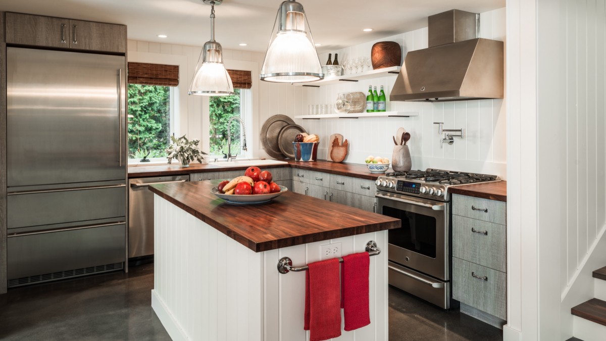 Modern kitchen in wood, white and gray inside the garage turned into a lovely home