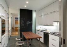 Modern-kitchen-with-open-island-in-steel-and-chalkboard-wall-in-the-backdrop-60064-217x155