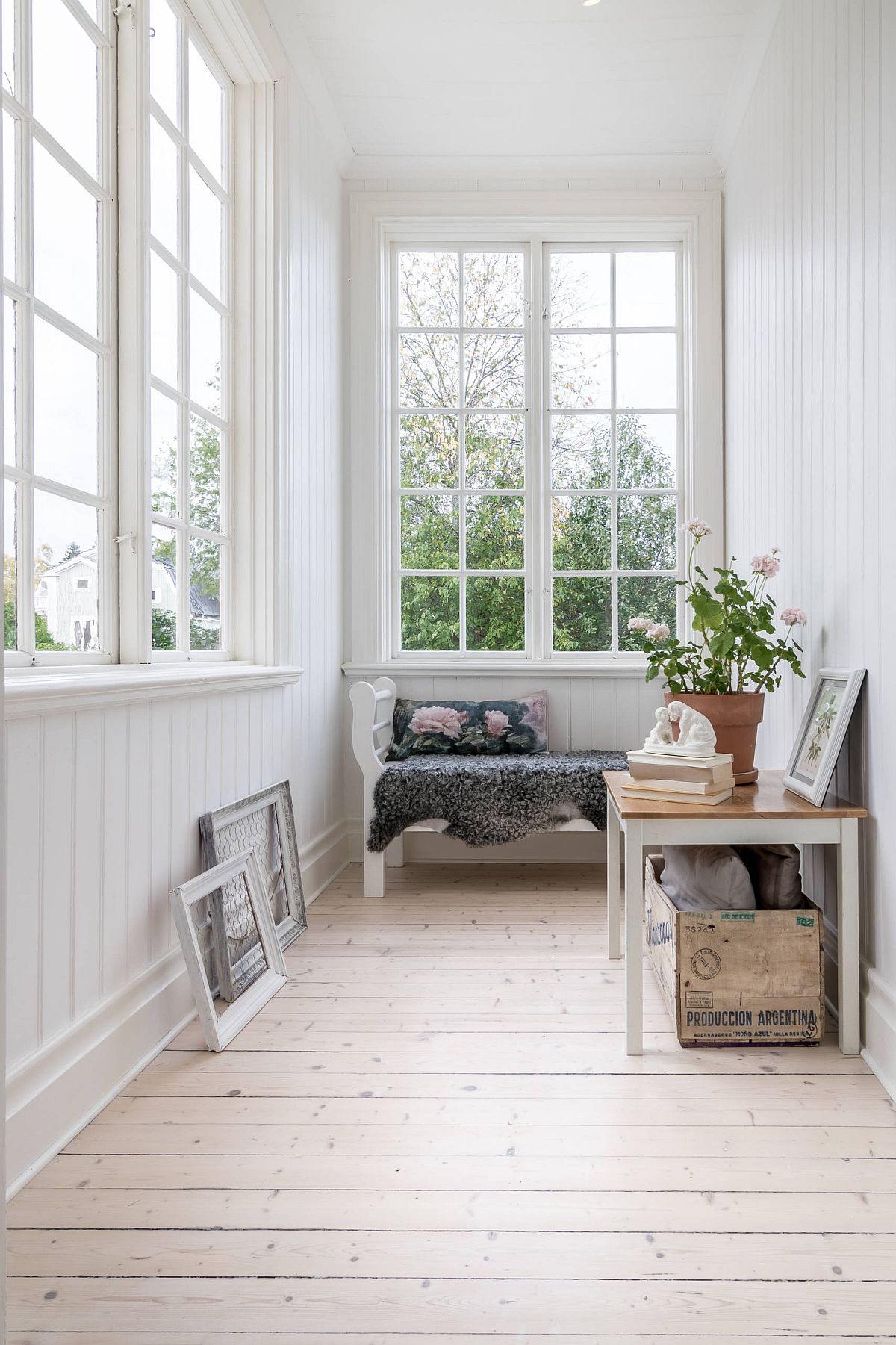 Modest white sunroom with a bright interior that keeps things simple