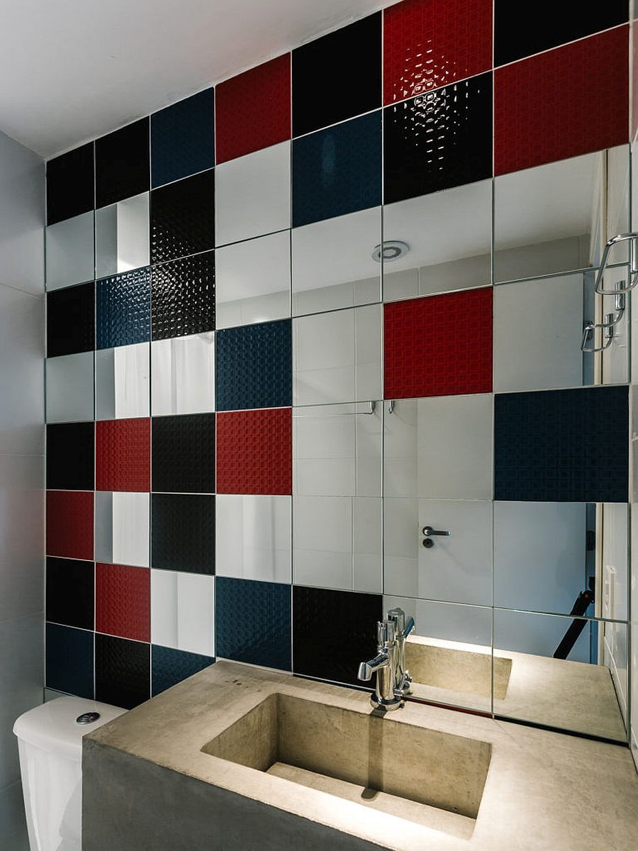 Multi-color tiled walls in the kitchen with black, red and blue tiles