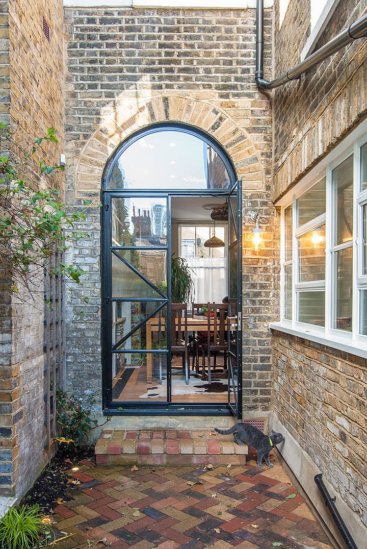 New windows and doors combine classic arched form with modern functionality