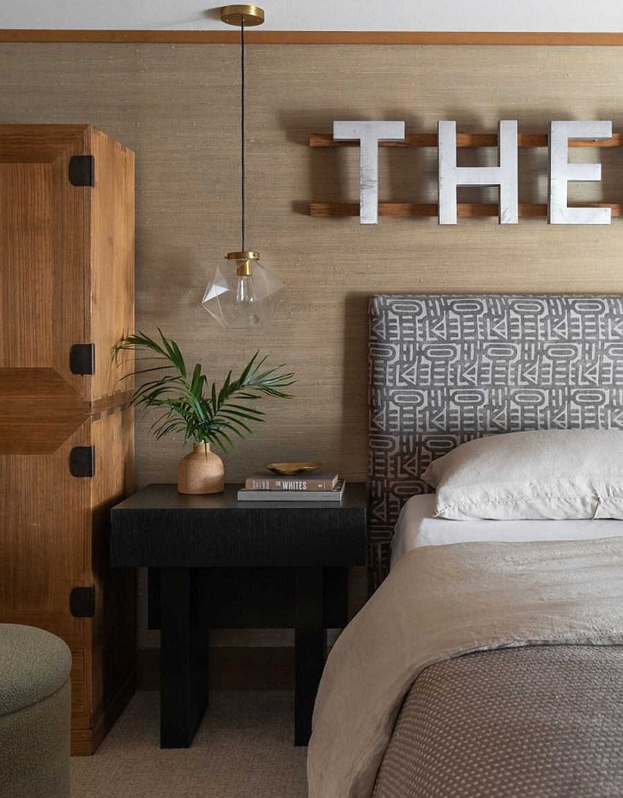 Pendant, decor and custom wall additions bring modern minimalism to the bedroom of the midcentury home