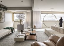 Polished-contemporary-living-room-of-the-Brazilian-apartment-in-white-with-swing-chair-Pêndulo-by-Ruy-Ohtake-66465-217x155