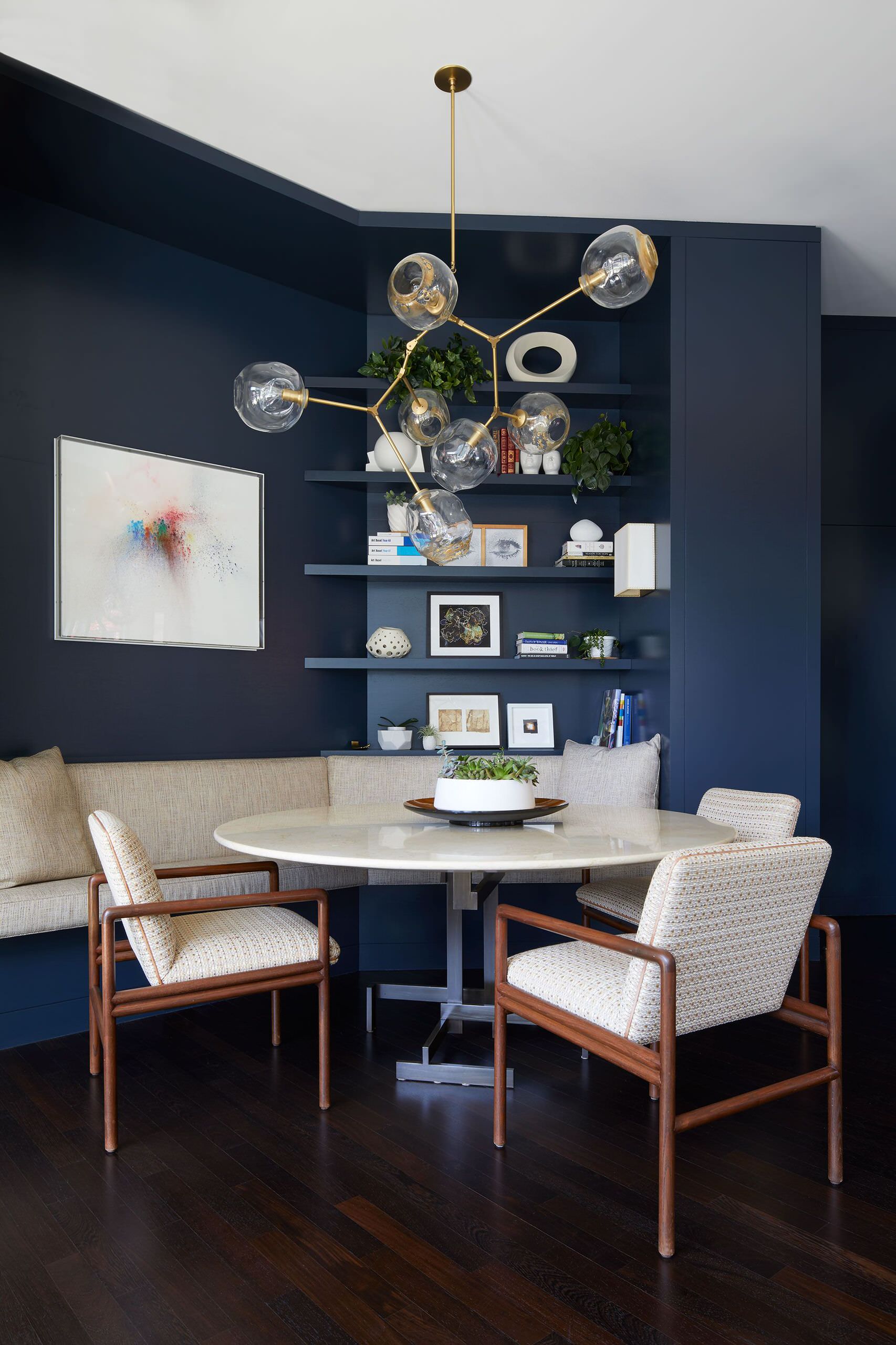 Polished small dining room of Tribeca home with a gorgeous gray backdrop