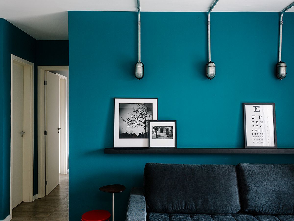 Simple ledge-style floating shelf in black is the perfect space for a lovely display in the living room