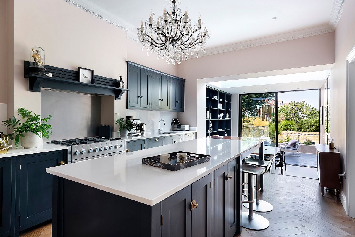 Sliding glass doors connect the spacious kitchen of the London home with the outdoors