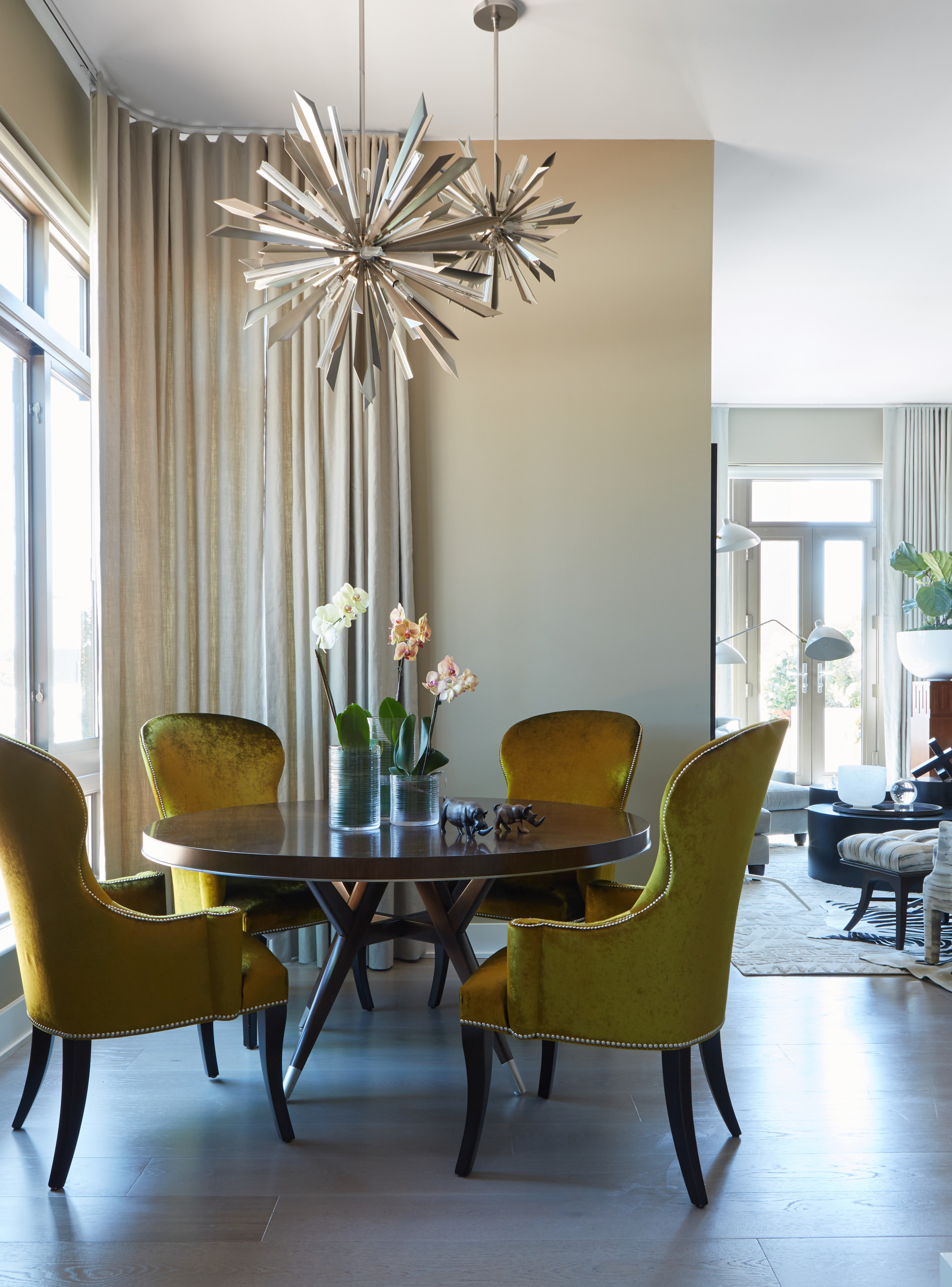 Small-contemporary-dining-room-of-NYC-condo-with-bright-yellow-green-chairs-that-add-an-air-of-luxury-16735