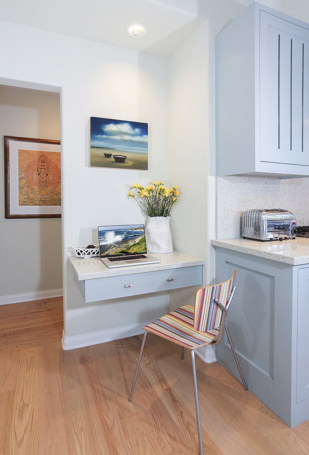 Smart and space-savvy workspace in the kitchen created using a floating drawer in the corner