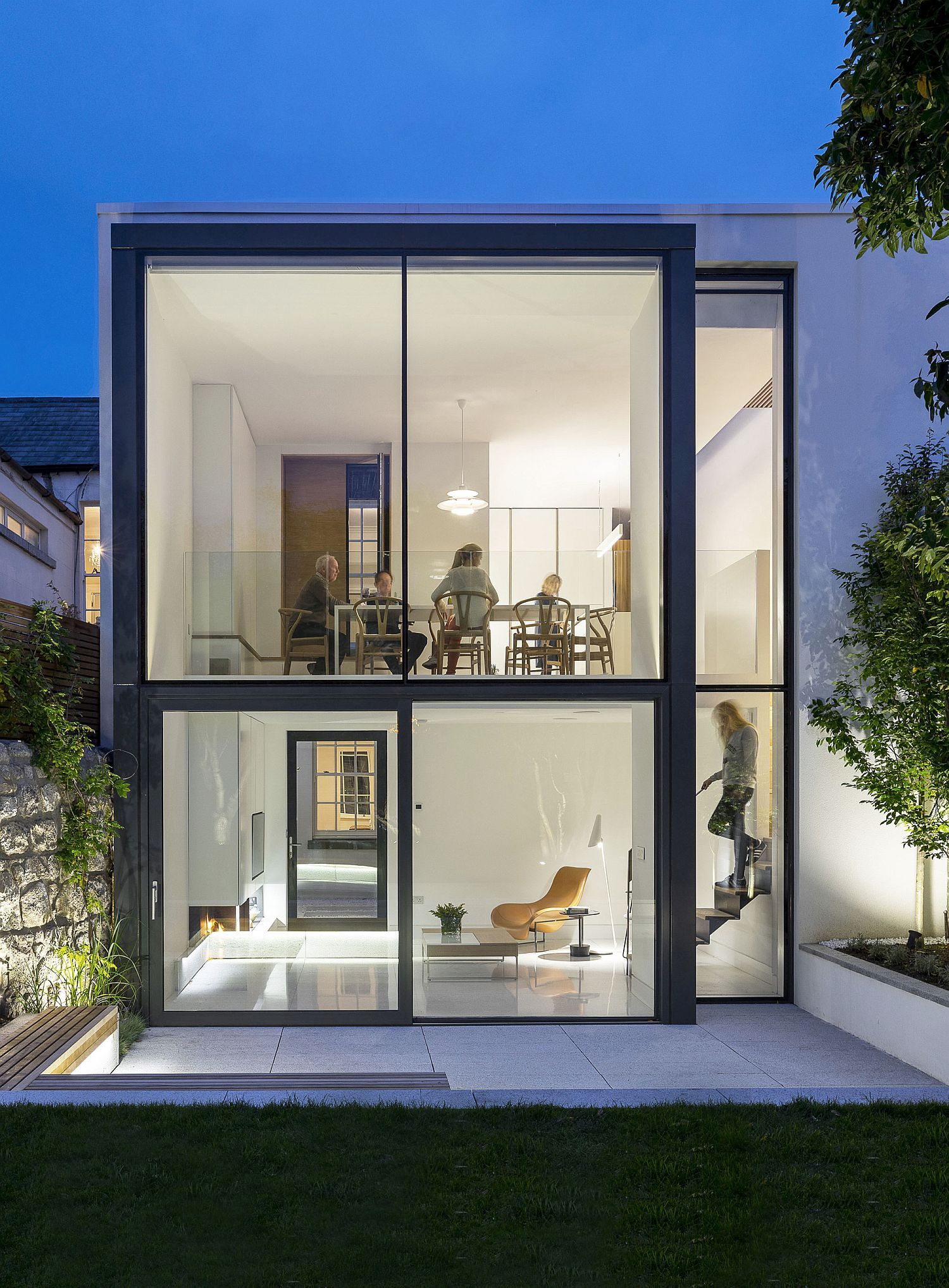 Smart and stylish rear extension of Victorian home in Sydney with floor-to-ceiling glass walls and a touch of gray