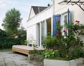 Modern Infusion: Elevated Wooden Deck Extends this Modest 60’s Home in Paris