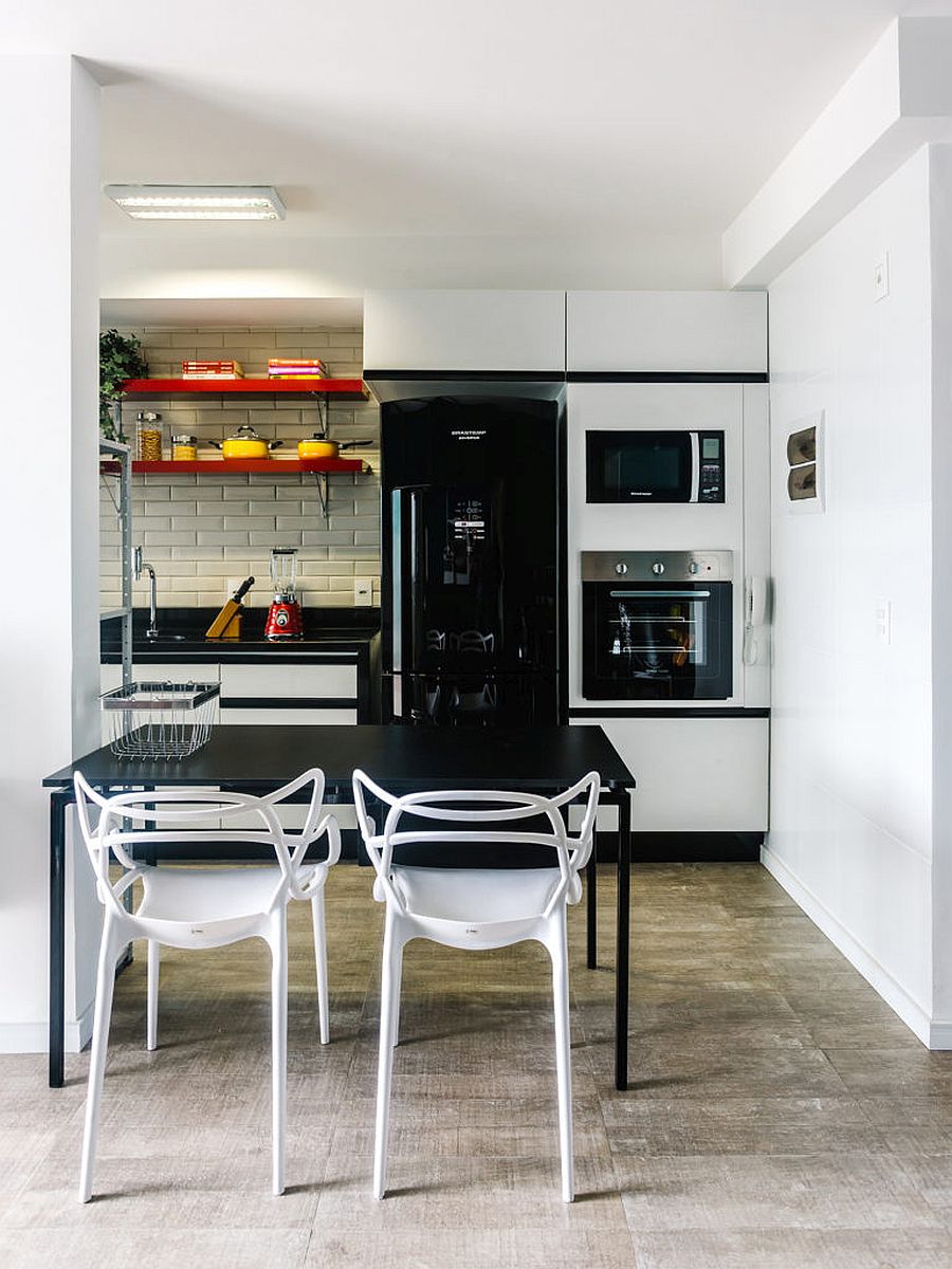 Space-savvy kitchen and dining area of the small Brazilian apartment