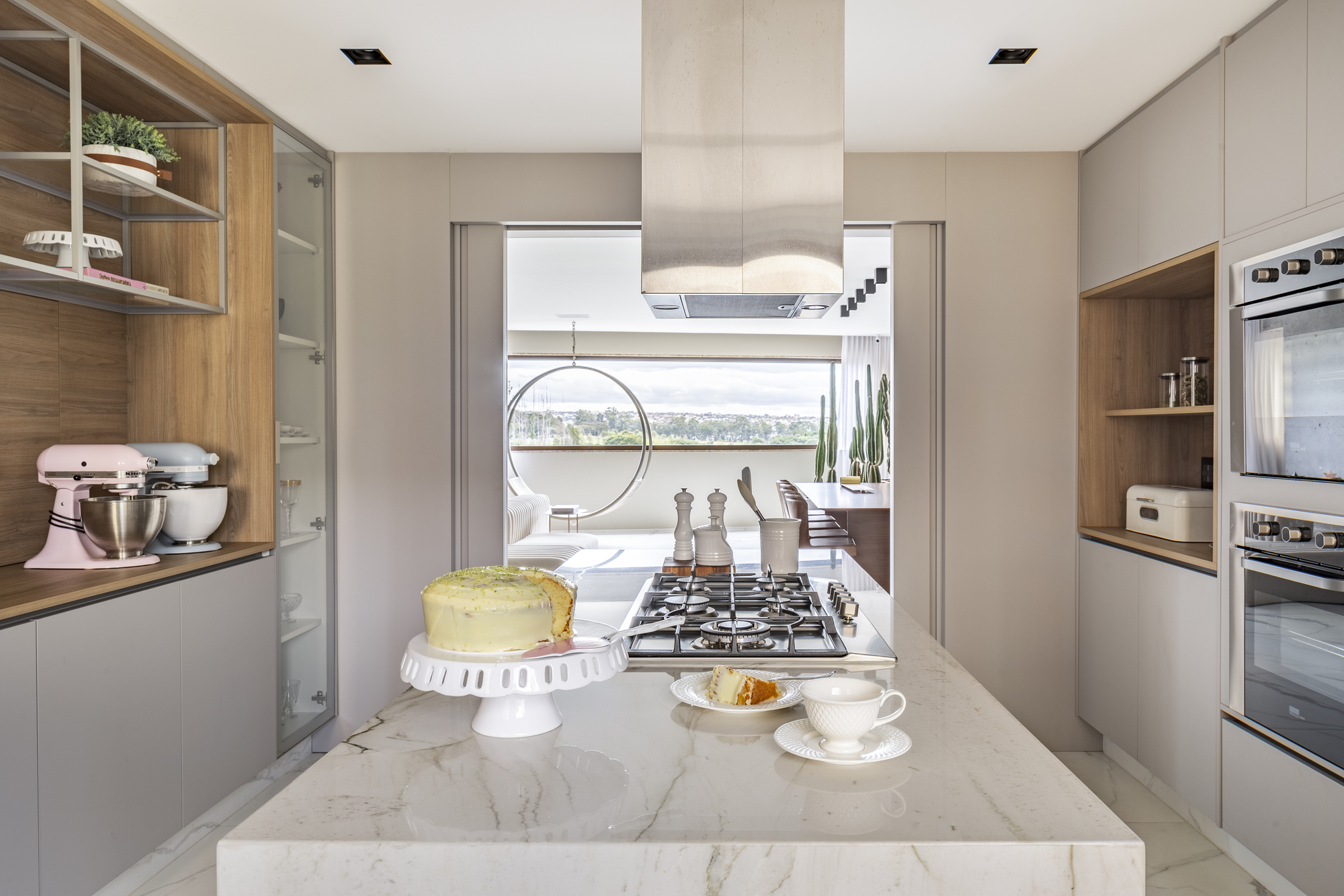 Spacious and stylish modern kitchen in white and wood with a Mont Blanc quartz central island