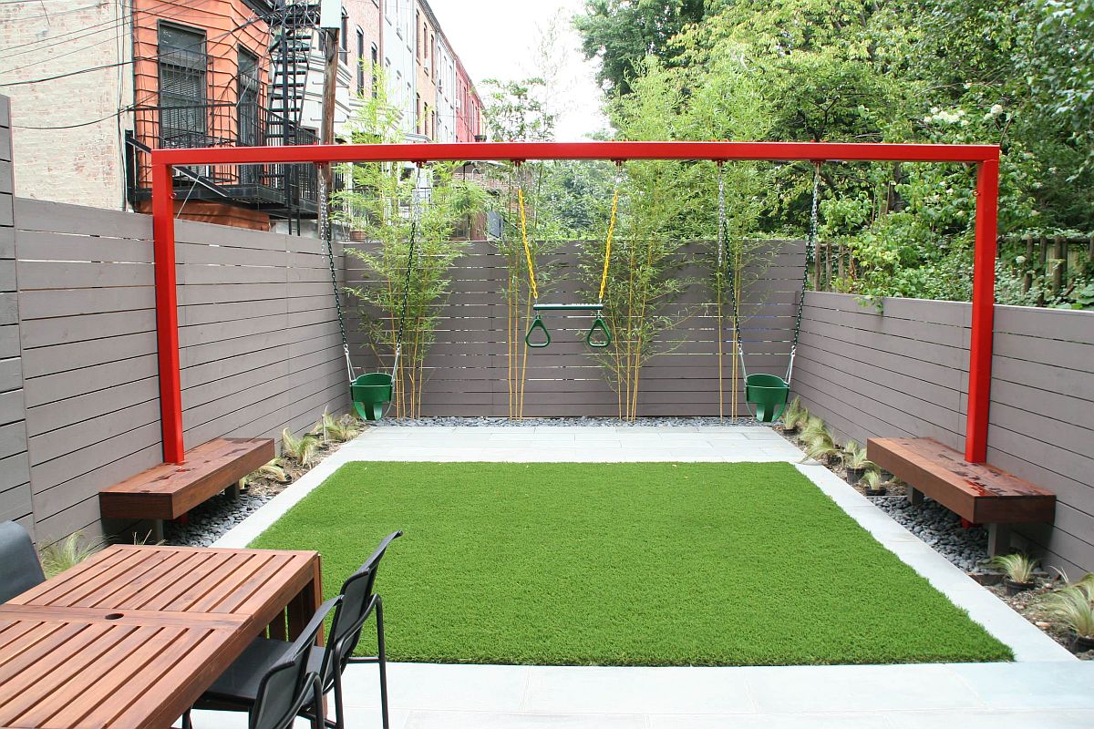 Swings add a sense of fun and excitement to this small urban backyard