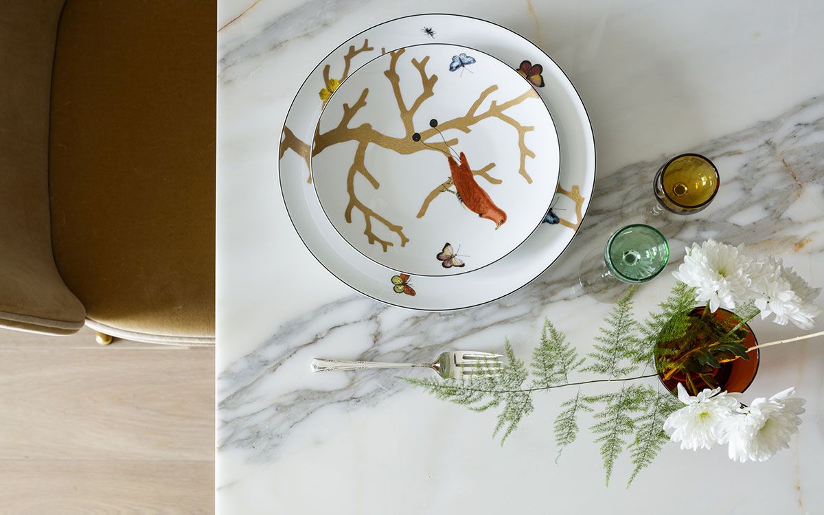 Tableware and vases bring nature-inspired prints to this contemporary dining table