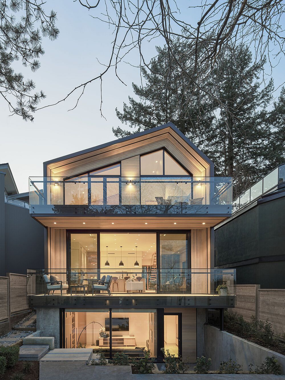 Three levels of the modern Vancouver home in wood, glass and white