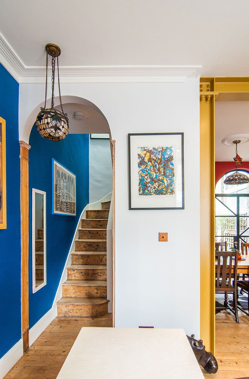 Timber staircase with skylight leads to the upper level with bedrooms