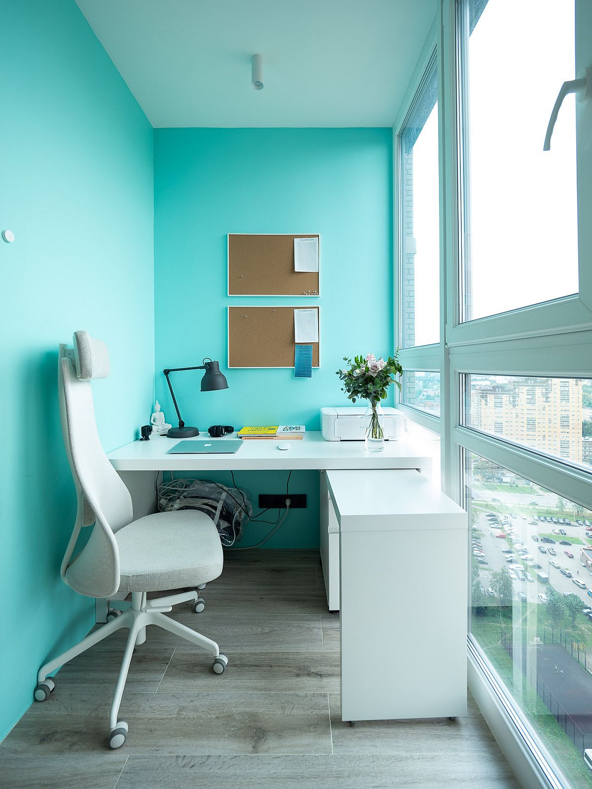 Tiny home office of Moscow apartment with lovely blue walls along with floor-to-ceiling glass walls