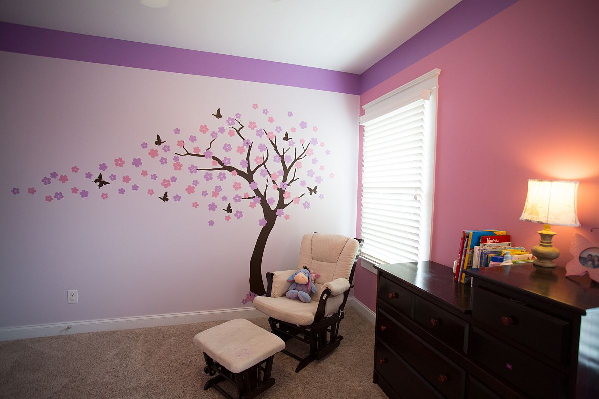 Transitional nursery combines pink and violet with a beautiful tree decal