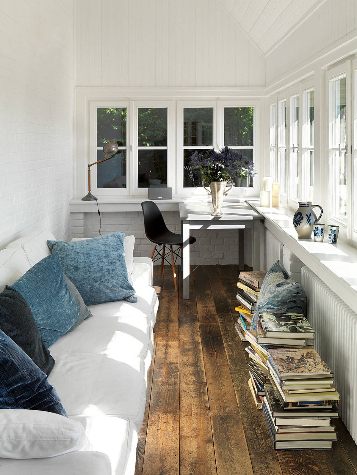 Turn the lovely modern farmhouse style sunroom into a place to work and relax