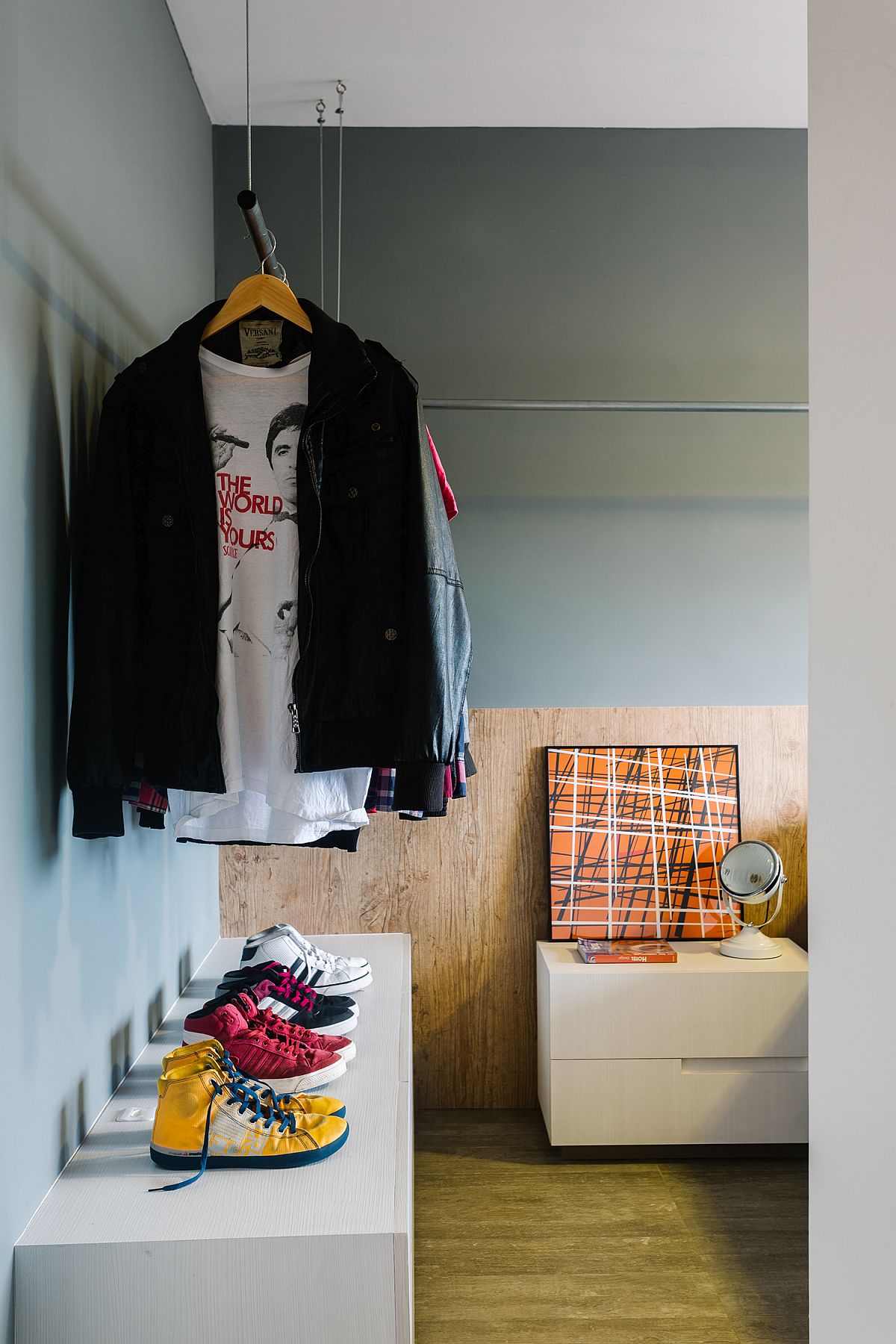 Use the closet rods to create an open wardrobe in the small bedroom