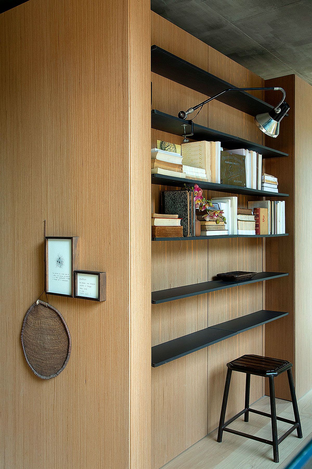Using slim, floating shelves inside the wardrobe create a smart workspace in the bedroom