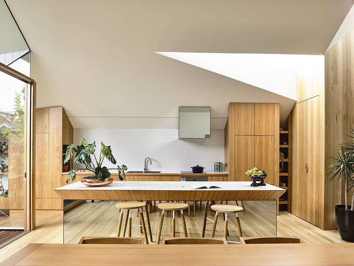 Wood-and-white-kitchen-island-top-is-beautifully-combined-with-a-mirrored-base-for-a-unique-and-eye-catching-centerpiece-92422