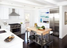 Wood-and-white-kitchen-with-steel-appliances-and-a-lovely-cart-style-island-with-steel-base-and-wooden-countertop-95198-217x155