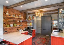 Beautiful-farmhouse-kitchen-with-exposed-brick-wall-section-and-cabinets-in-brick-red-with-an-orangish-tinge-60998-217x155